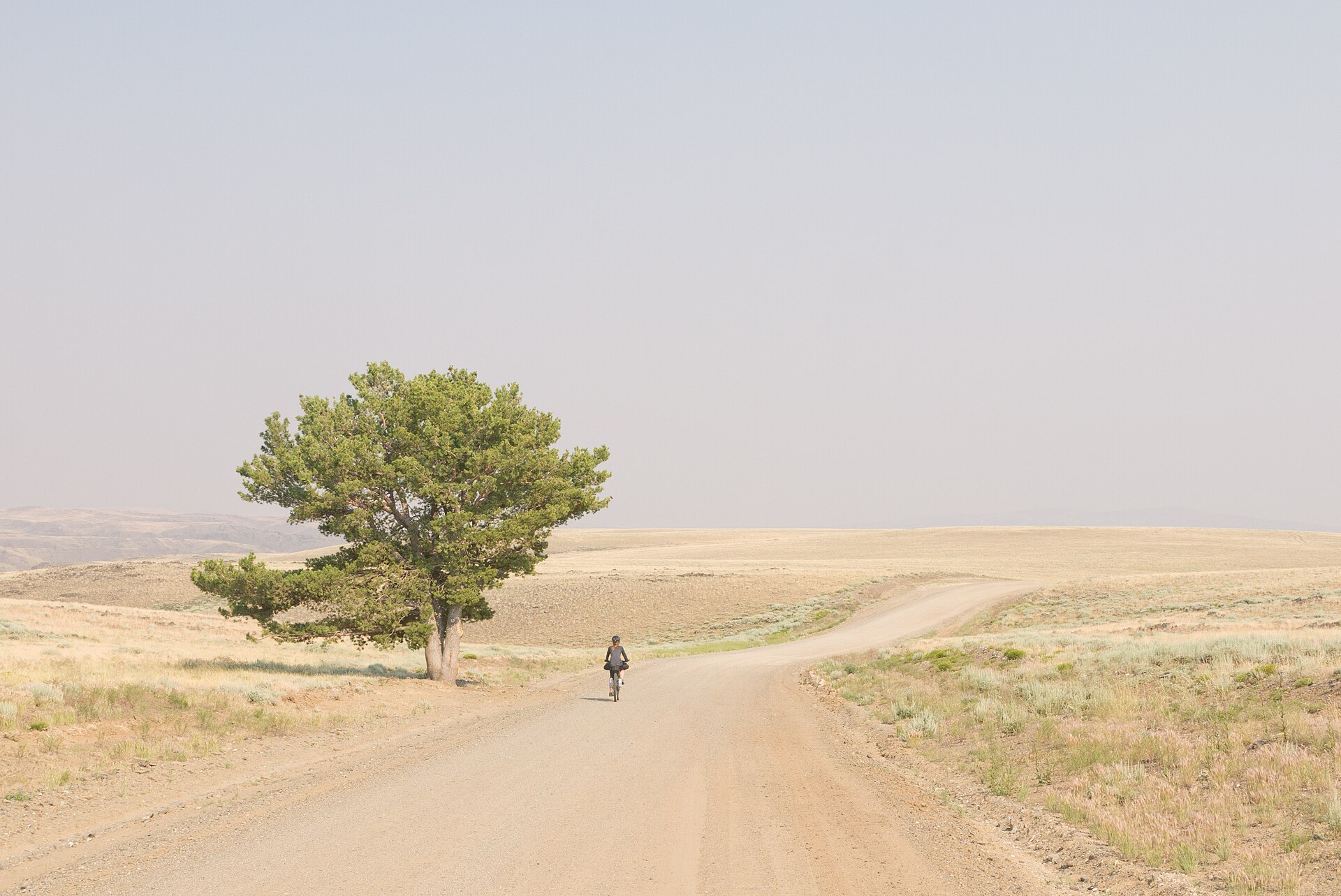 A loaded touring bike on a gravel road