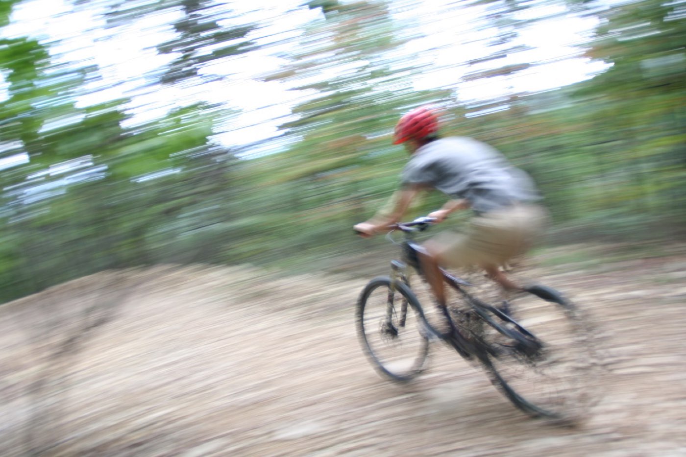 A mountain biker railing singletrack