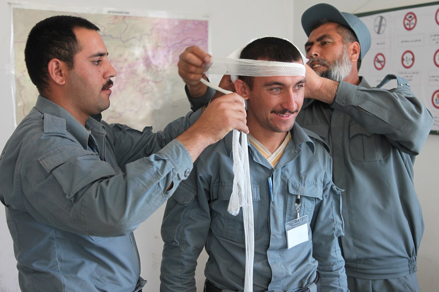 Practicing bandaging at a first aid training